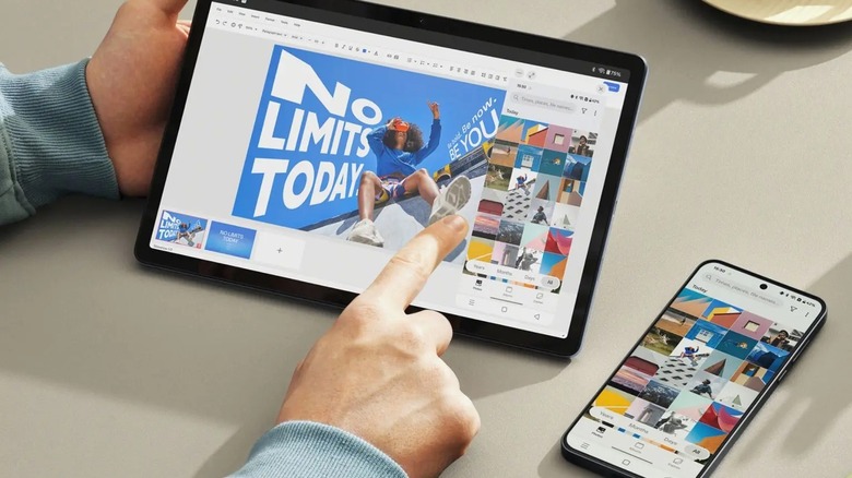 Two hands using a OnePlus Pad Lite with the OnePlus phone sync