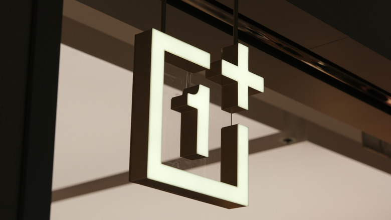 Close-up of OnePlus logo outside a store