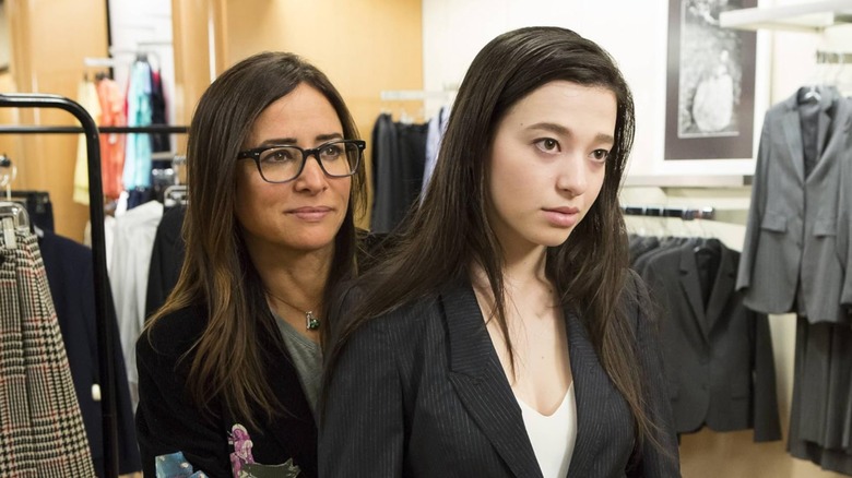 Pamela Adlon and Mikey Madison in the series "Better Things," the photo shows Adlon behind Madison, and both are wearing suits