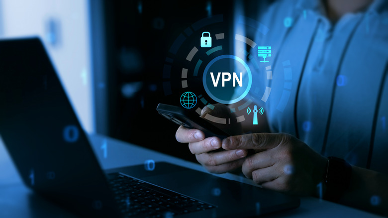 Person using a phone with a laptop in front of them, VPN showing in a digital illustration floating above hands