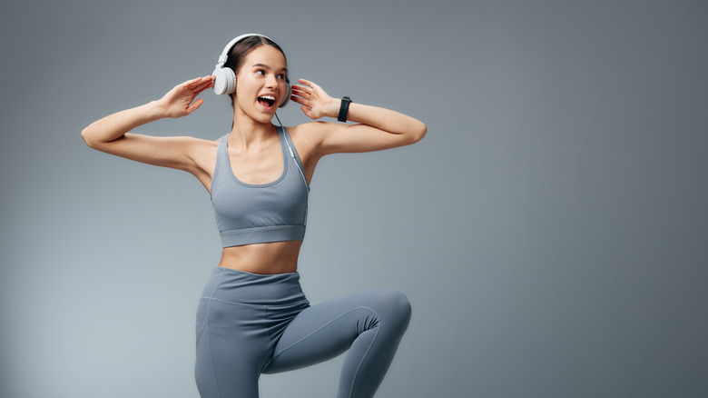 A person exercising while wearing headphones
