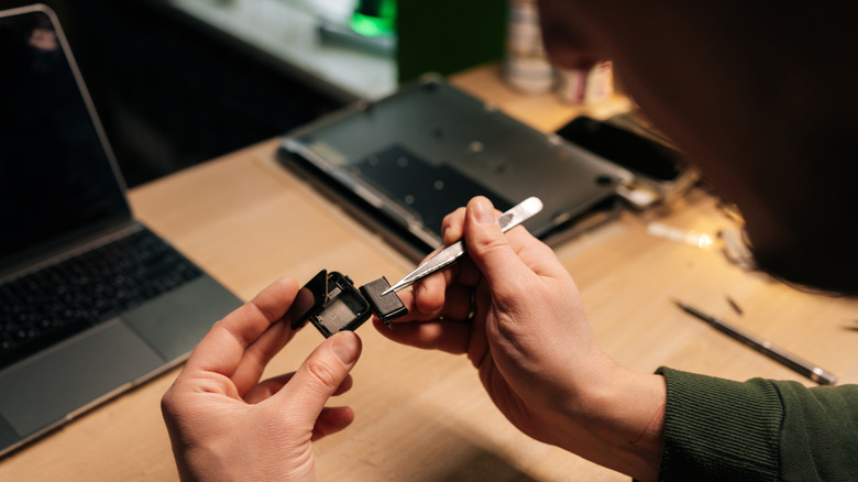 person working on a smartwatch