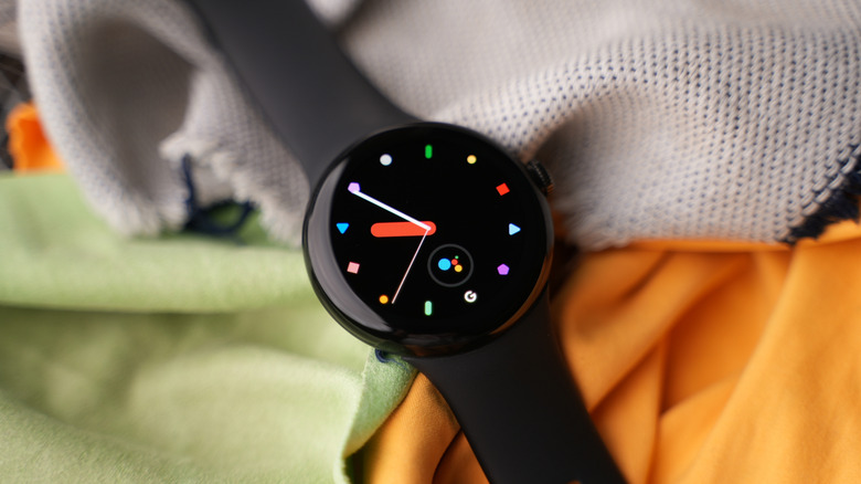 google pixel watch sitting on a bed