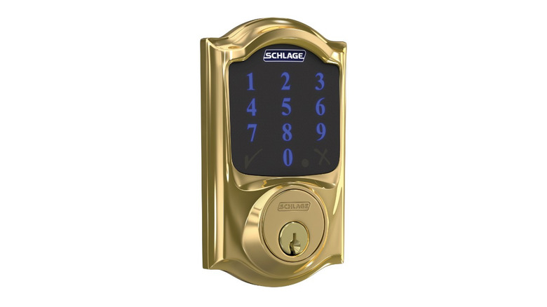 Schlage smart lock with a gold finish, illuminated touchscreen keypad, and keyhole.