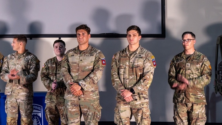 A group of soldiers line stand before a presentation screen, ready to pitch the Modular Drone Case at the Dragon's Lair XI event.