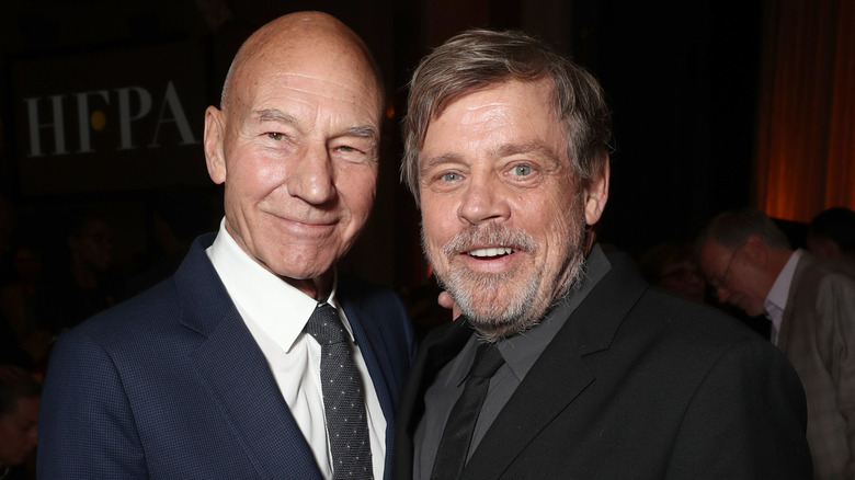 Patrick Stewart and Mark Hamill at HFPA event stood together smiling