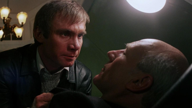 Steve railsback grabs the collar of Patrick Stewart in 