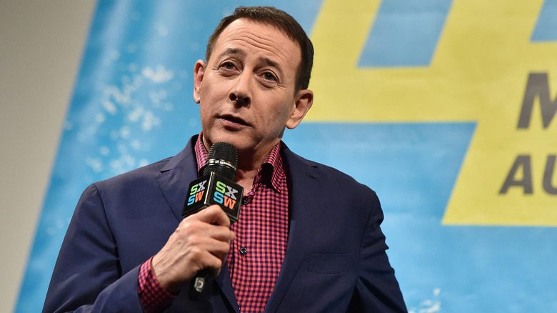 Paul Reubens with a microphone