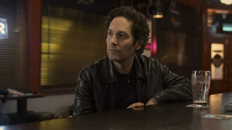 Rick Power sitting in a bar and looking at something off camera