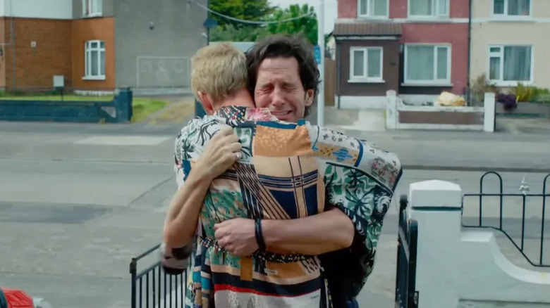 Rick hugging his best friend while crying