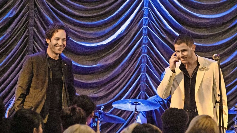 Rick and Danny smiling on stage before performing together