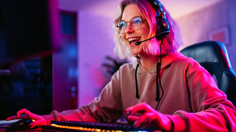 a young woman gaming on her PC