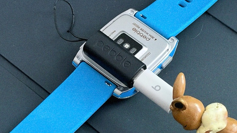 Close-up shot of a Pebble Time 2 charging
