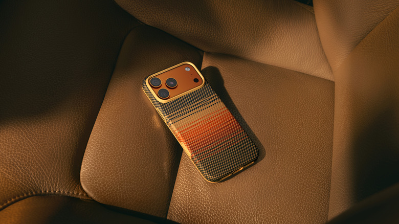 PITAKA's iPhone 17 Apex Series Aramid UltraGuard Case sitting on a car seat