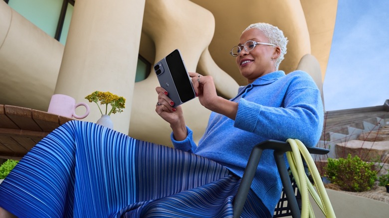 A person using the Pixel 10 Pro Fold unfolded.