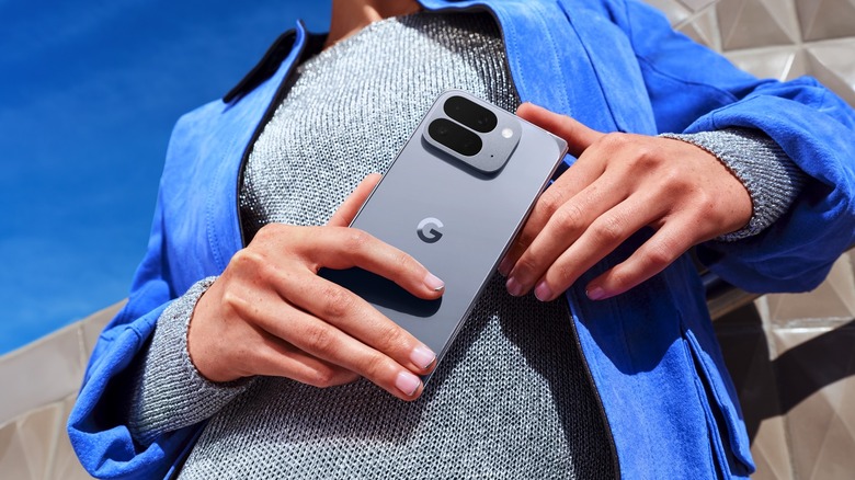 A person holding the Pixel 10 Pro Fold folded.