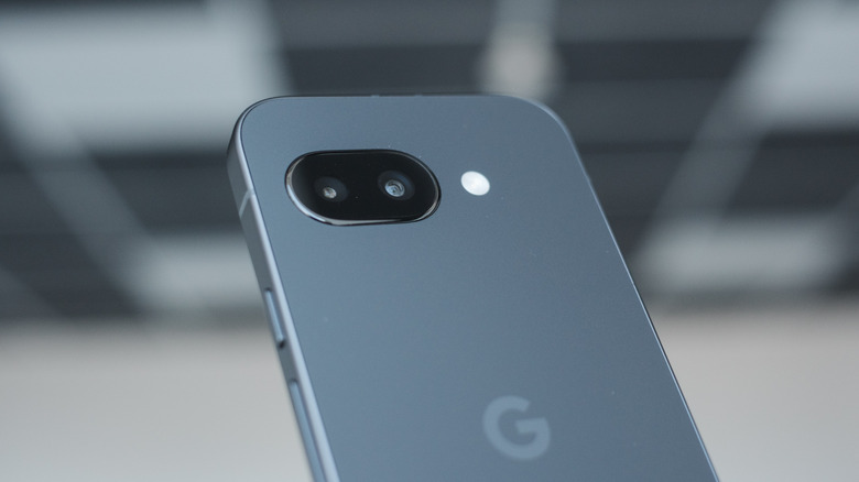 Google Pixel 9a against a blurred background