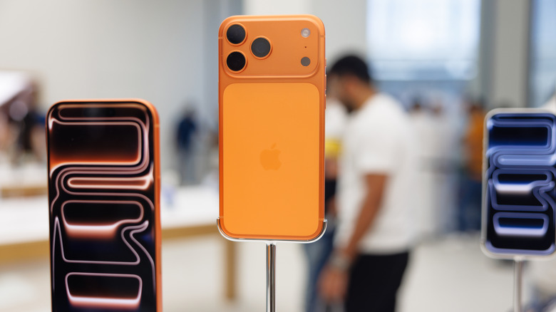 iPhone 17 Pro models on display in a store.