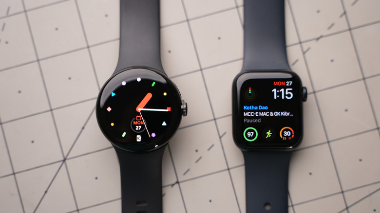 A Google Pixel Watch and an Apple Watch next to each other