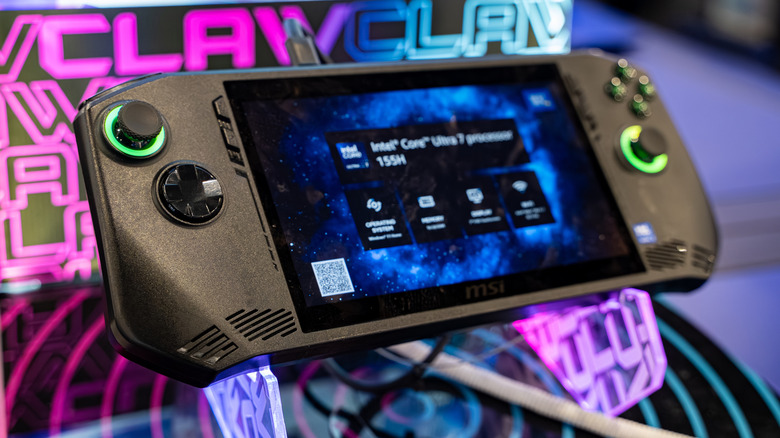 A closeup of the MSI Claw A1M handheld gaming device, the device sits on what appears to be a promotional stand