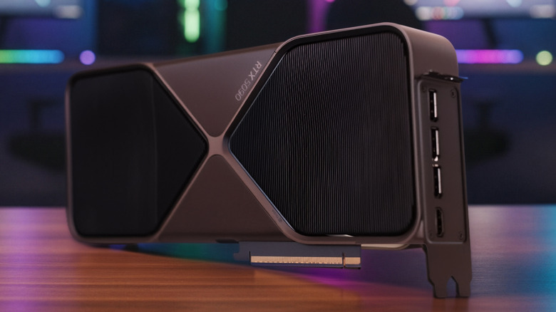 Nvidia RTX 5090 FE on a dark wood desk