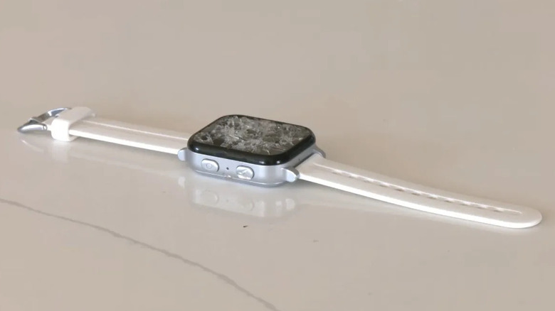 A child's smartwatch with a broken screen.