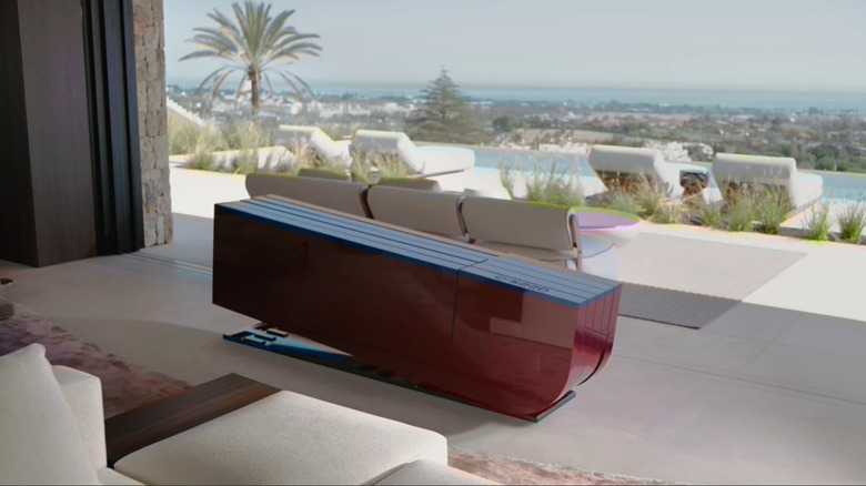 the C Seed Porsche TV unfolding in a living room.