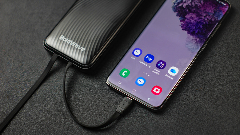 A phone being charged by a power bank