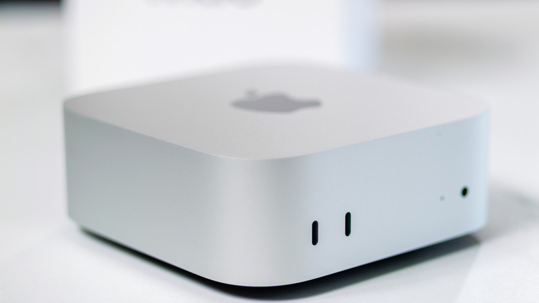 mac mini placed on a white table with its box in the background