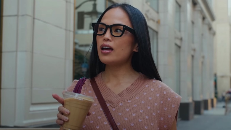 A person wearing Android XR smart glasses.