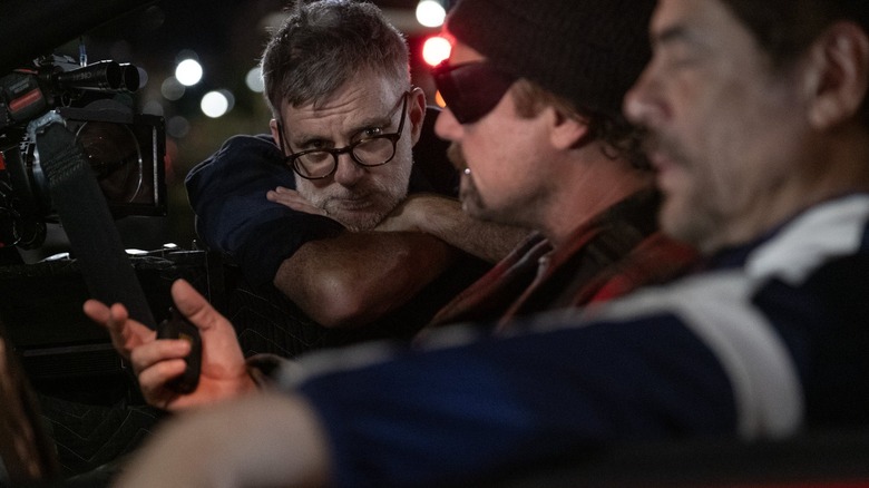 Paul Thomas Anderson directs stars Leonardo DiCaprio and Benicio del Toro on the set of One Battle After Another