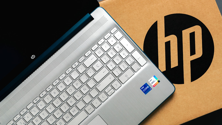 HP laptop on a cardboard box with the HP logo on it
