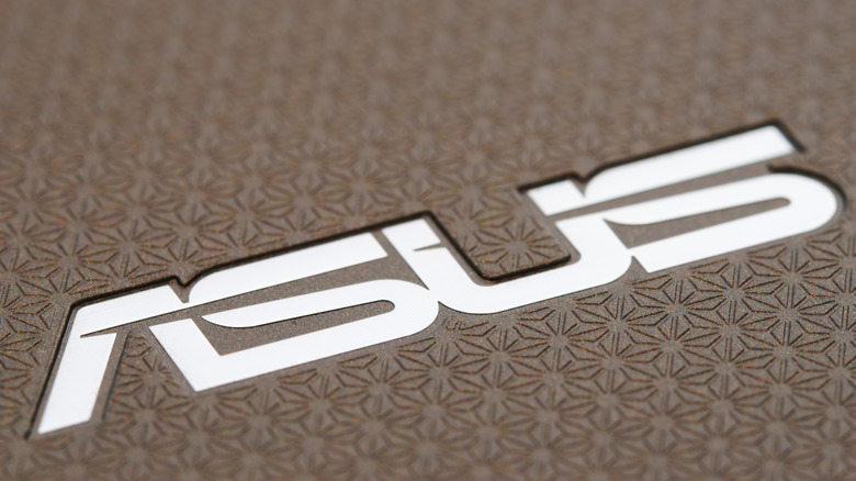 Asus logo on a textured honeycomb background