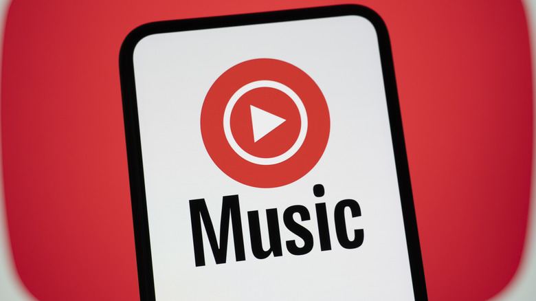 The YouTube Music logo on a smartphone