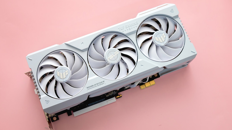 White Asus RTX GPU sat on a pink table