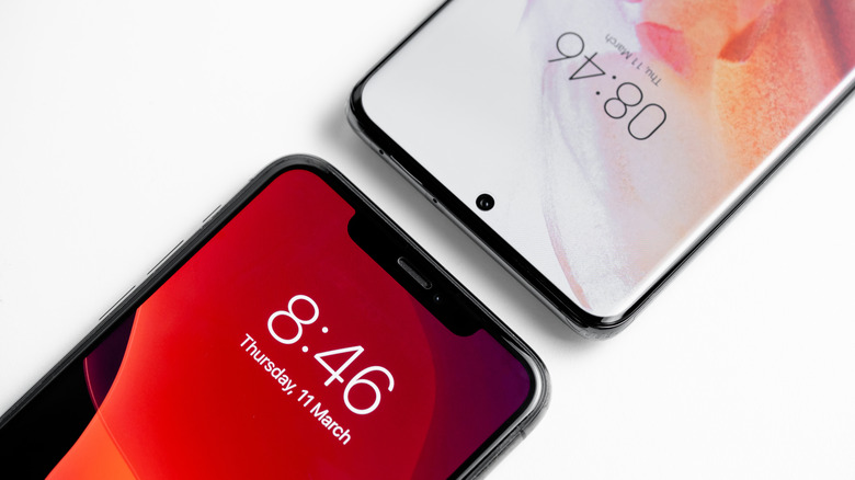 Samsung Galaxy S21 front view in comparison with iPhone 11 Pro Max on a white background
