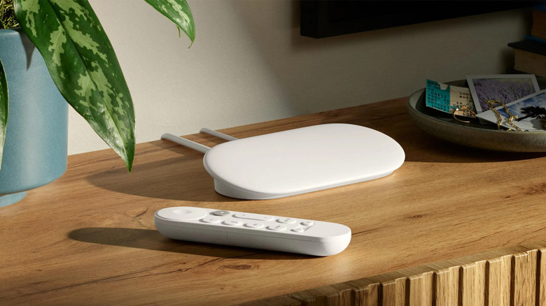 Google TV Streamer and Remote on wooden cabinet