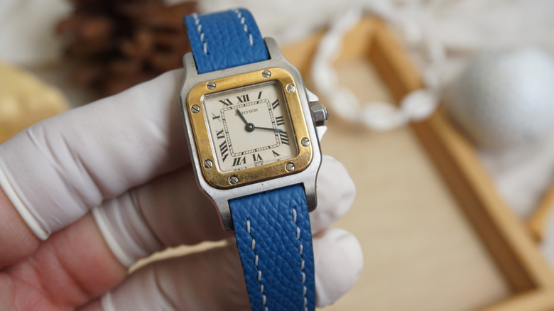 Cartier Santos Galbee held in gloved hands