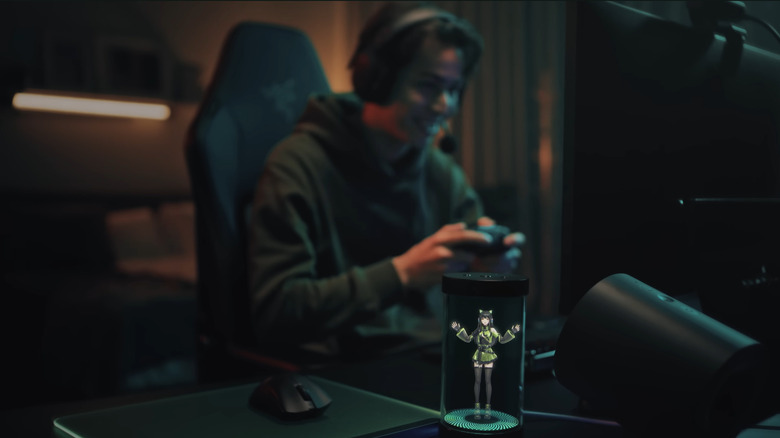 A cat-eared human hologram stands with its arms raised inside Razer's glass