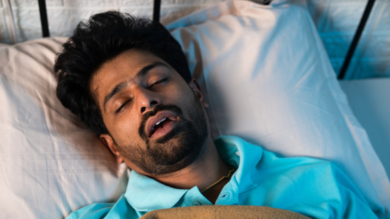 A man sleeping with his mouth open.