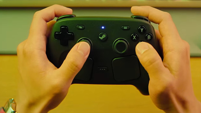 Hands holding a Valve's Steam Controller