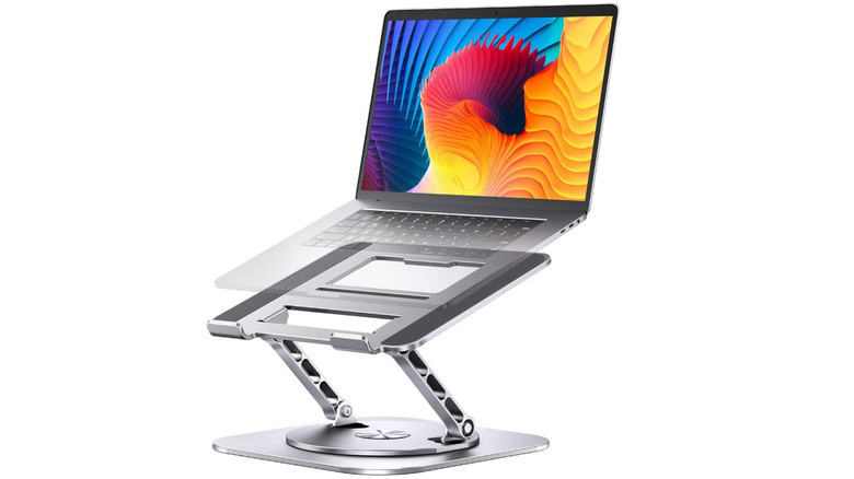 Laptop sitting on top of extended laptop stand