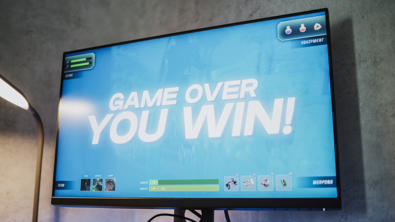 A computer monitor displaying the words "game over, you win!"