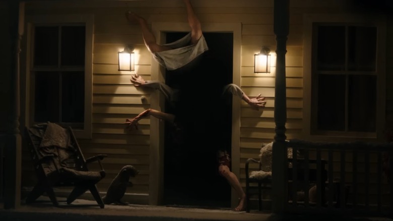 Limbs coming out of a doorway in Resident Evil