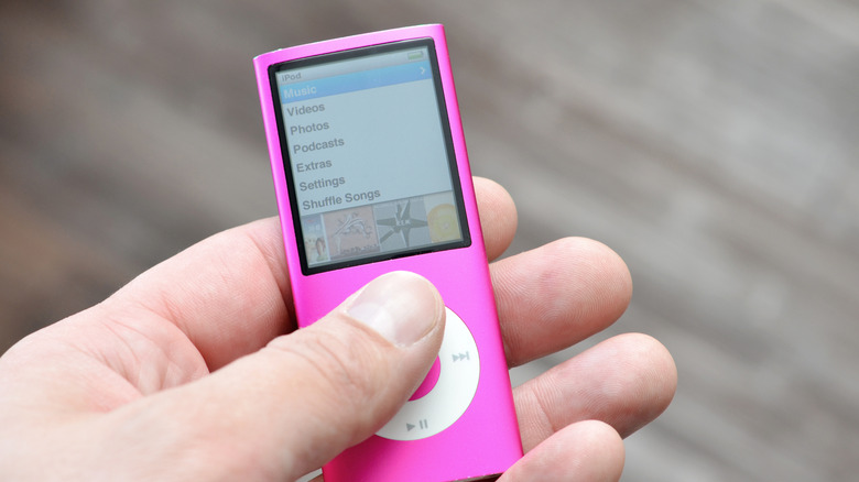 person holding an ipod nano