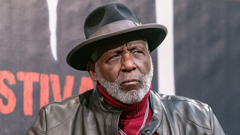 Richard Roundtree sitting on a stage.