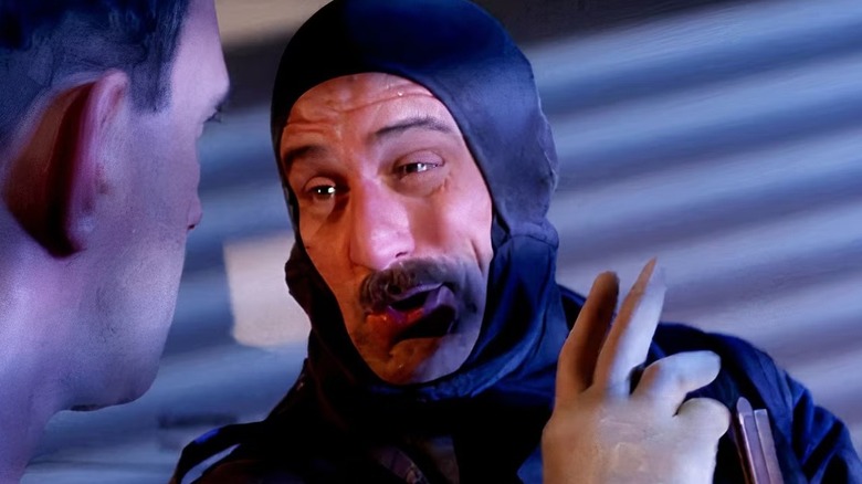 Harry Tuttle (Robert De Niro) looking at another man in "Brazil."