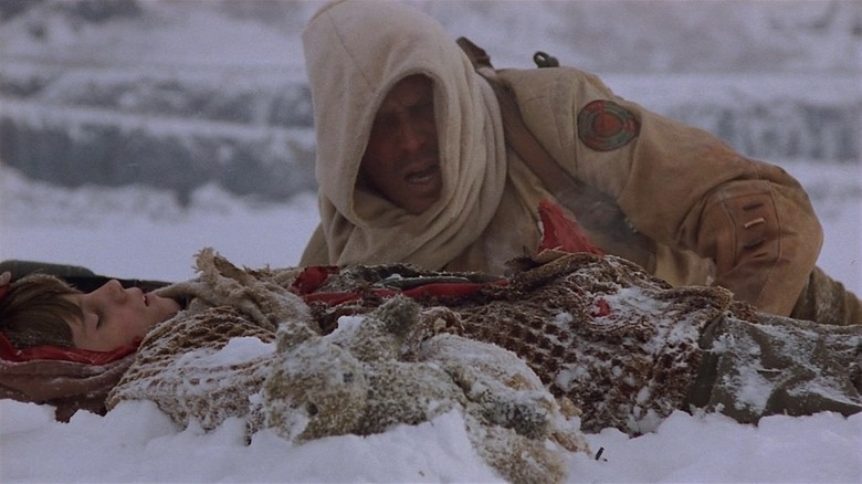 Hendricksson saving a young boy in the snow