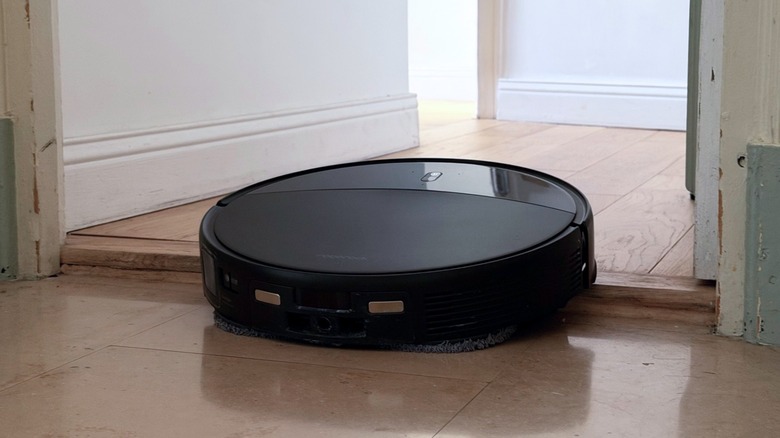 A robot vacuum trying to pass a threshold