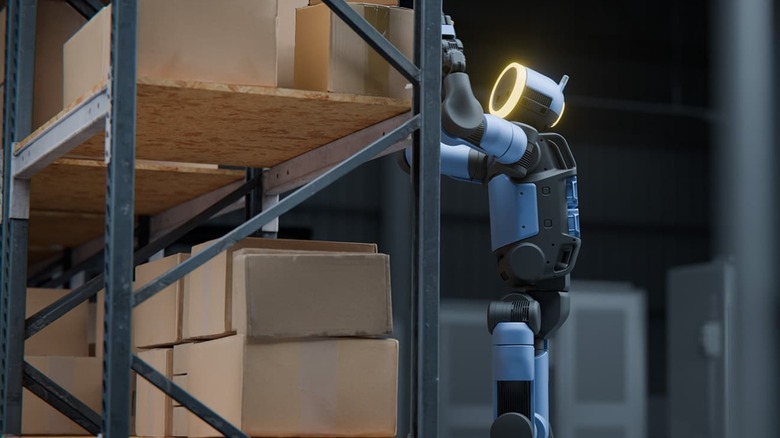 A render of Boston Dynamics' Atlas robot stacking boxes on shelves.
